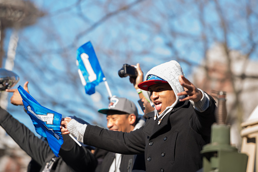 Seattle, USA - February 5th, 2014: Malcolm Smith waving at the crowd during the Seahawks homecoming parade on 4th avenue after the XLVIII Super Bowl win.