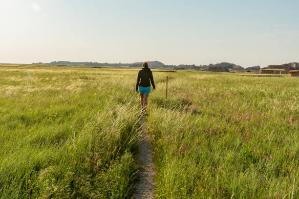 istock Woman Hikes Through Badlands 1201727851