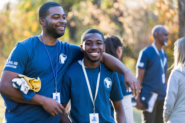 istock Brothers bond in morning before park cleanup begins 1201729973