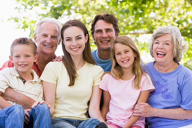 istock Three-generation family smiling at the park together 120173046
