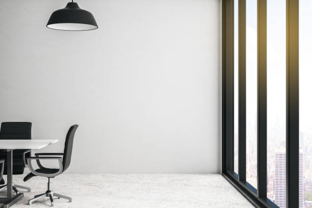 istock Modern conference room with city view, light wall and concrete floor. 1201737640