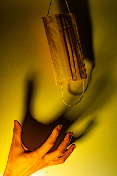 istock A hand want to taking a medical mask 1201738986