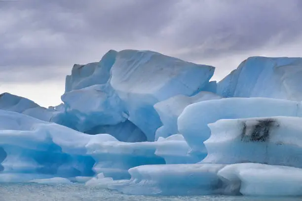 Blue icebergs floating in the jokulsarlon lagoon in Iceland in theautumn