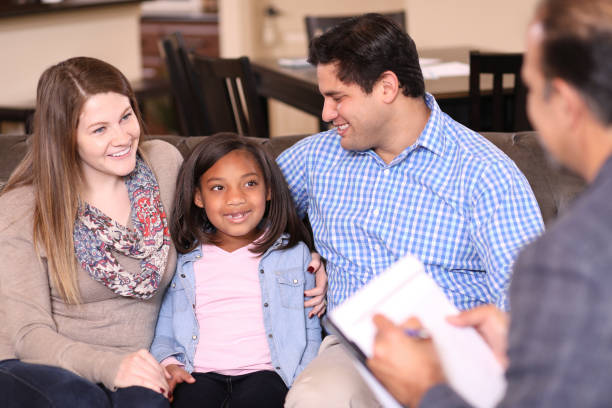 istock Family counseling session at home with therapist. 1201741144