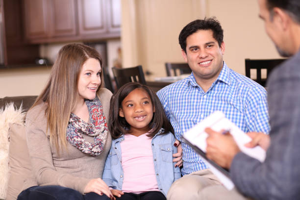 istock Family counseling session at home with therapist. 1201741182