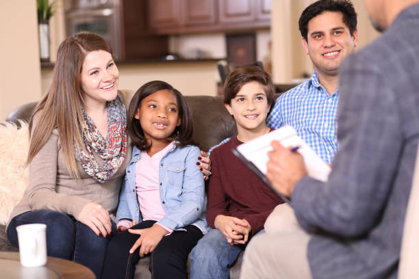 istock Family counseling session at home with therapist. 1201741513