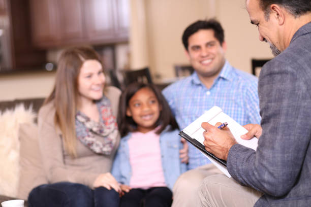 istock Family counseling session at home with therapist. 1201741713