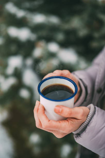 istock Woman Holding Cup of Coffee 1201743352