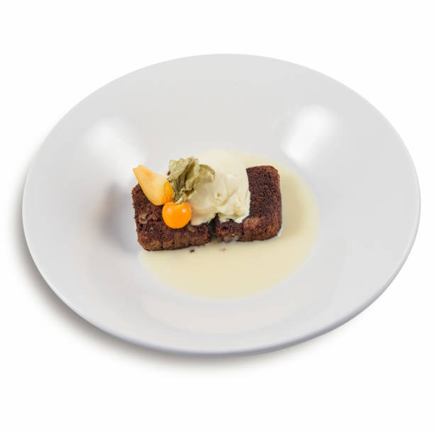 istock Chocolate Walnut Brownies with vanilla icecream and physalis 1201746745