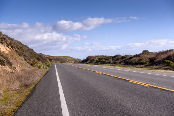 Wide angle street level view of the famous California Highway 1.\n\nTaken from California Highway 1, California, USA