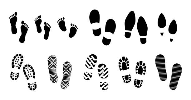 set of black human footprints or human shoe sole or funny footsteps paw. set of black human footprints or human shoe sole or funny footsteps paw. easy to modify footprint stock illustrations