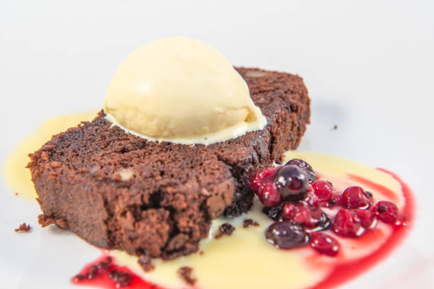 istock A chocolate and walnut brownie with vanilla icecream and berries 1201750080