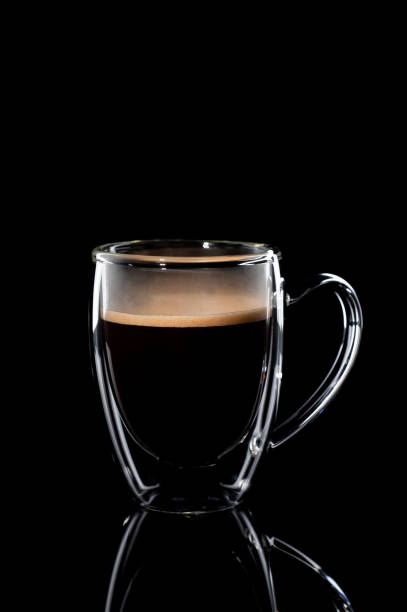 istock black coffee in a glass transparent cup on a black background 1201754642