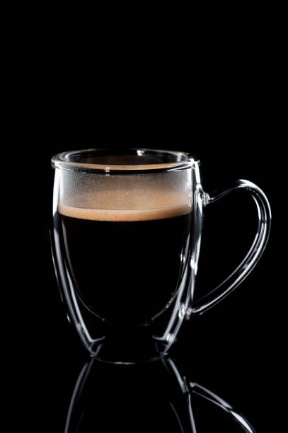 istock black coffee in a glass transparent cup on a black background 1201754669