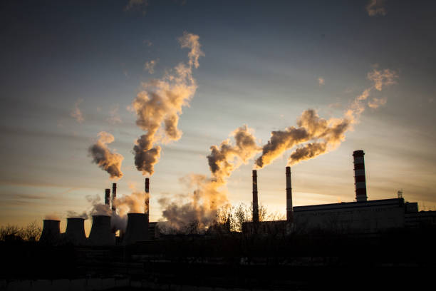 istock Dramatic sunset on the sky and coal power plant factory 1201756000