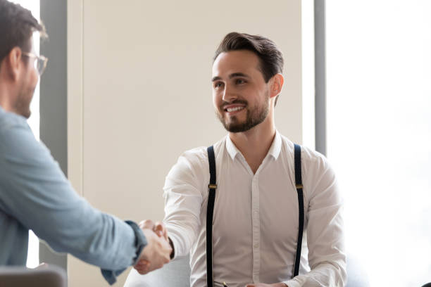 istock Businessmen start formal meeting shake hands express respect 1201756545