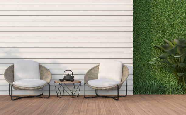Empty wall exterior with white wood plank 3d render Empty wall exterior 3d render,There are white wood plank wall and wooden floor,decorate with rattan lounge chair, decorate wall with green plant. patio stock pictures, royalty-free photos & images