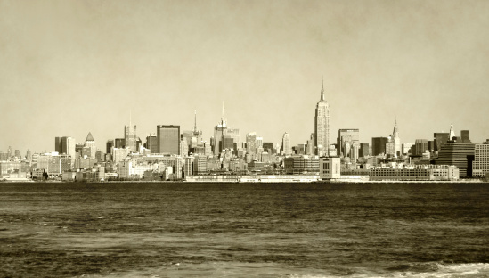 Manhattan skyline in daytime, old stained photo