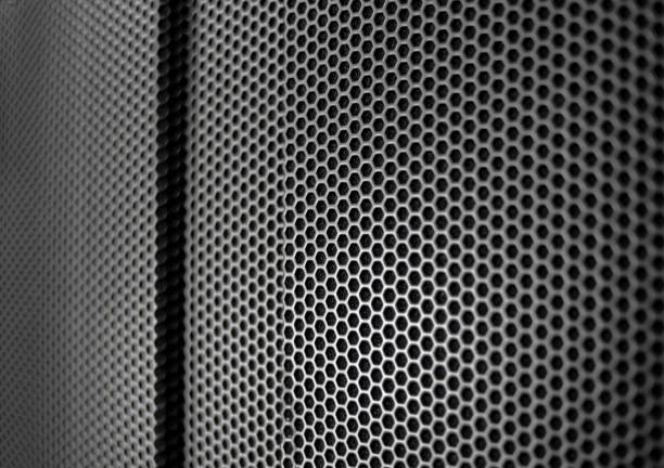 istock Hexagonal pattern in gray and black cells with side lighting. Protective metal grill. 1201762551