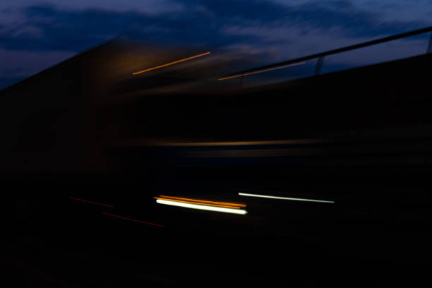istock Light trails from the cars on highway 1201767770