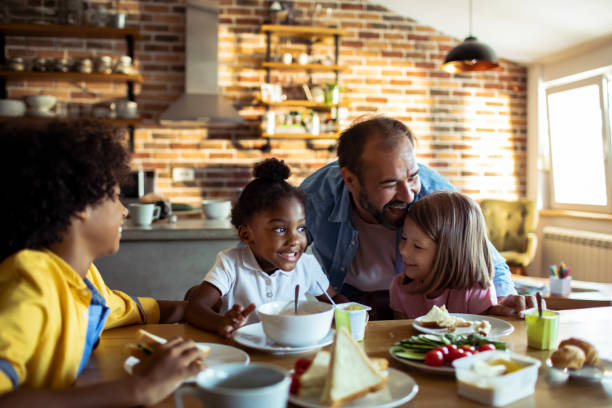 istock Single father having breakfast with his kids 1201780445