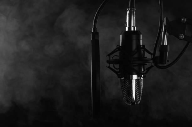 istock Studio Microphone isolated on a white background. Smoke banner 1201782450