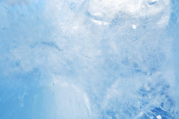 Ice plunging into a glass of cola, double exposure