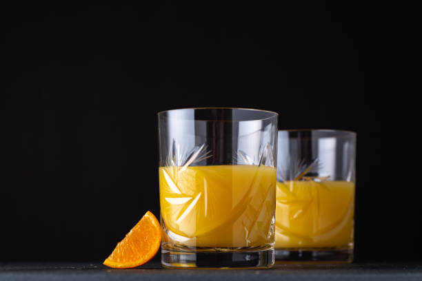 istock Orange juice in cut crystal glasses 1201783576