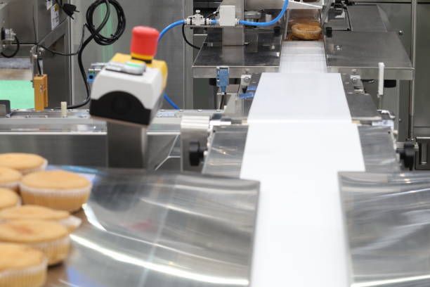 istock cupcake packing machine ; food industrial business background 1201789547