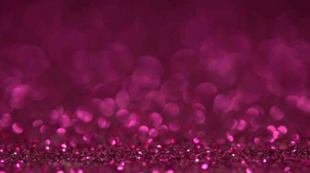 istock Maroon brilliant beautiful holiday texture in motion. Magic bokeh background 1201791405