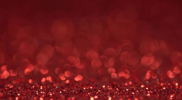 istock Red glitter festive defocused lights background 1201791406