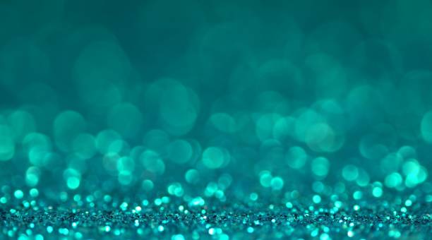 istock Mint blue brilliant shiny sparkly texture. Light bokeh effect abstract background 1201791417