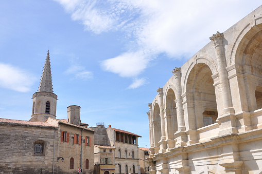 arene d'Arles, city in the south of France. bell tower and arena nearby
