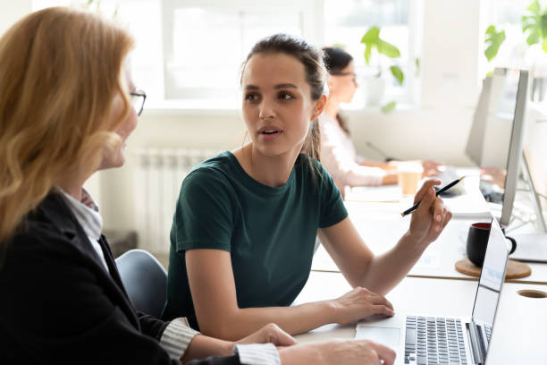 istock Different age female teammates working together on new project indoors 1201798698