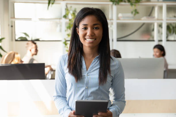 african ethnicity young businesswoman leader of department company representative portrait - business looking at camera office new imagens e fotografias de stock