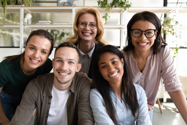 istock Multiethnic diverse ethnicity age staff members smiling looking at camera 1201798728