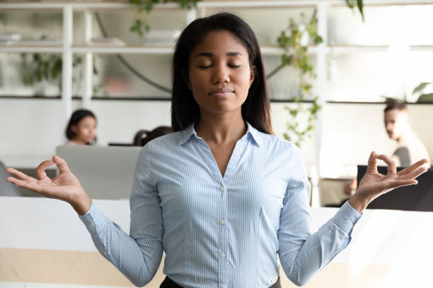 istock Biracial woman office worker take break during meditating avoid stress 1201798729