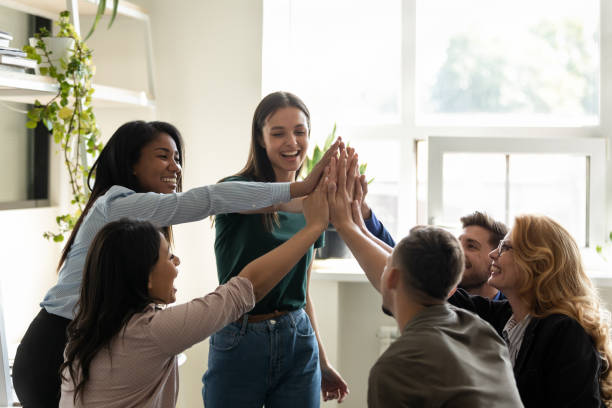 istock Associates giving high five starting project wish success each other 1201798736