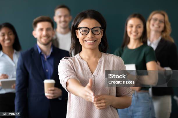 Mixed Race Woman Sales Manager Stretch Out Hand Greeting Client Stock Photo - Download Image Now