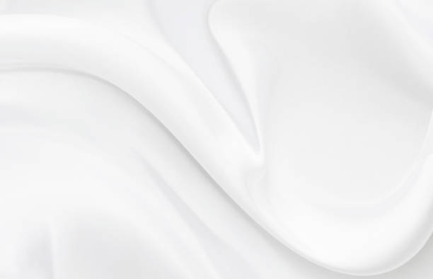 istock White gray satin texture that is white silver fabric silk background with beautiful soft blur pattern natural. 1201799515