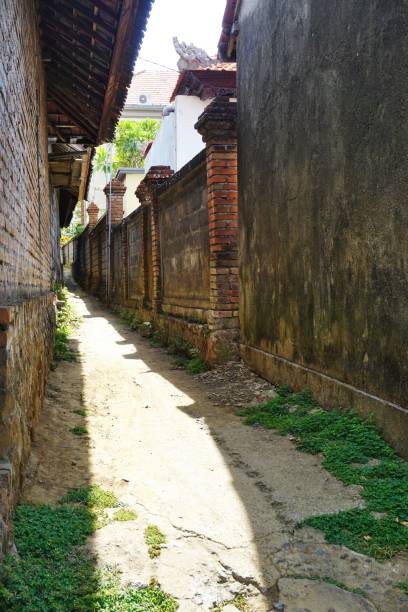 istock Sunlit alley in Bali Indonesia 1201804682