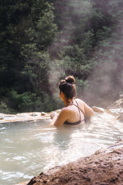 istock woman resting in an hot spring in oregon 1201809727