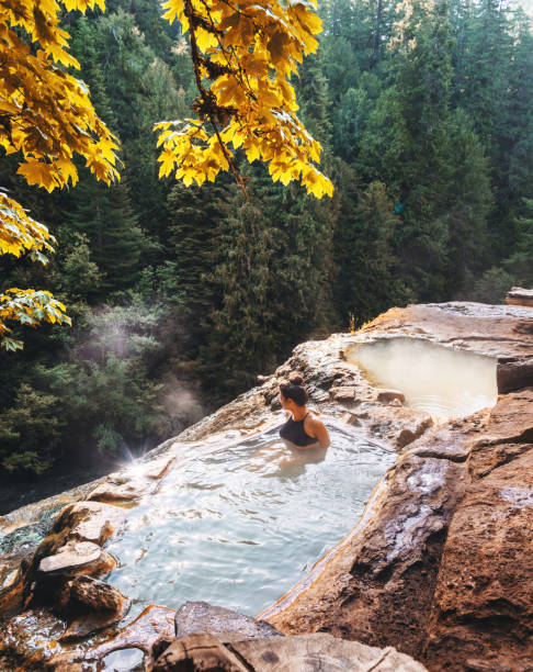 istock woman resting in an hot spring in oregon 1201809775
