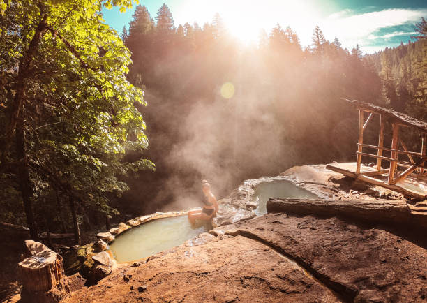istock woman resting in an hot spring in oregon 1201809785