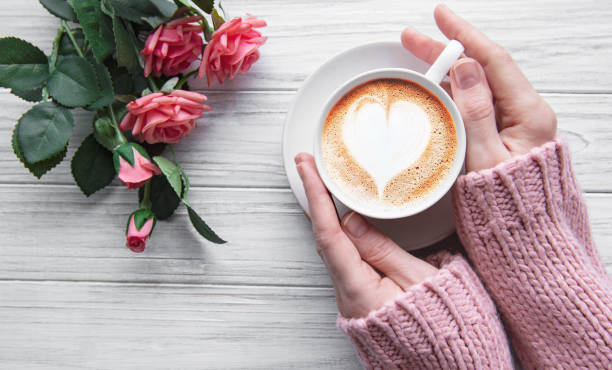 istock Woman holding cup of coffee 1201811880