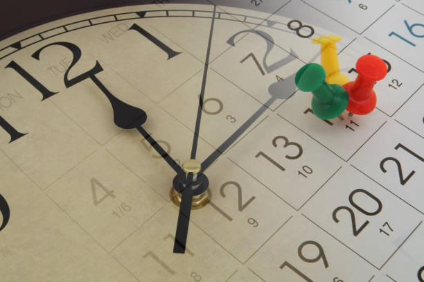 istock Clock and calendar page with colorful pins, time passing concept 1201811976
