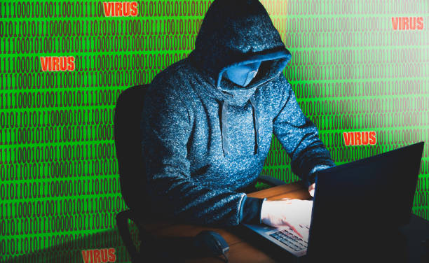 istock Man in hoodie is hacking personal data on green background. Information security. Virtual virus concept. Information protection. Bad password. 1201813146