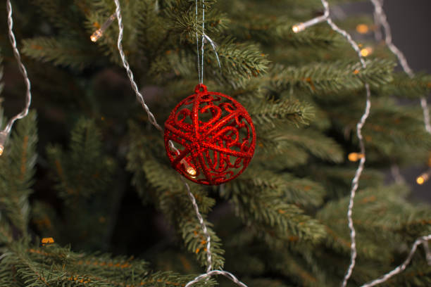 istock A round red toy  is on a christmas tree. 1201815438