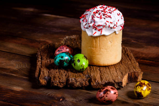 istock Easter cake and colorful eggs on a dark background 1201816749
