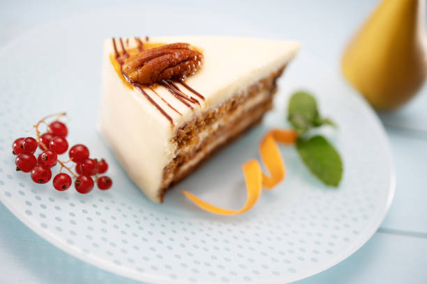 istock Carrots  cake piece with milk cream, carrots and nuts isolated, closeup 1201817879